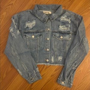 Crop distressed jean jacket. Size small, medium, and large.